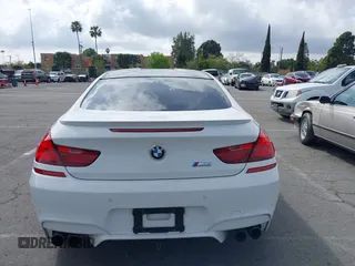 2013 BMW M6 z VIN WBSLX9C50DC968892, wystawiony jako IAAI lot #41935486 z przebiegiem 105 736 mil mil oraz . Historia ofert i sprzedaży dostępna na DreamBid. Obrazek 16.