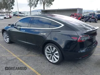 2018 Tesla Model 3 Long Range Battery with VIN 5YJ3E1EA9JF009384, listed as a IAAI auction lot 41544624 with 66,896 mi miles and . Bid and sale history available at DreamBid. Image 3.