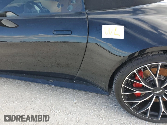 2023 Aston Martin Vantage z VIN SCFSMGBW9PGP08760, wystawiony jako Copart lot #74983814 z przebiegiem 1916 mil mil oraz Nie do naprawy. Historia ofert i sprzedaży dostępna na DreamBid. Obrazek 12.