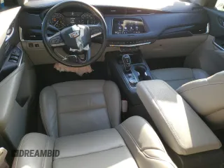 2021 Cadillac XT4 FWD Premium Luxury z VIN 1GYFZCR43MF021302, wystawiony jako Copart lot #41668755 z przebiegiem 46 047 mil mil oraz Szkody całkowita. Historia ofert i sprzedaży dostępna na DreamBid. Obrazek 8.