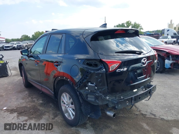 2016 Mazda CX-5 Touring with VIN JM3KE2CY5G0653108, listed as a IAAI auction lot 37717249 with 90,704 mi miles and . Bid and sale history available at DreamBid. Image 3.