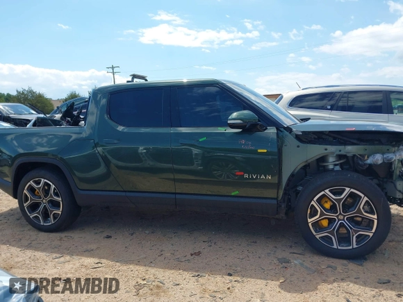 2023 Rivian R1T Adventure z VIN 7FCTGAAAXPN019894, wystawiony jako IAAI lot #42168226 z przebiegiem 23 380 mil mil oraz . Historia ofert i sprzedaży dostępna na DreamBid. Obrazek 14.