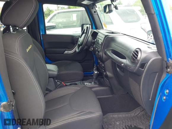 2015 Jeep Wrangler Sahara with VIN 1C4AJWBG9FL663959, listed as a IAAI auction lot 42133900 with 56,253 mi miles and . Bid and sale history available at DreamBid. Image 5.