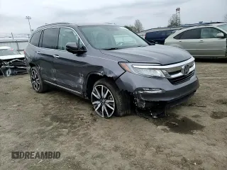 2020 Honda Pilot Touring 7-Passenger z VIN 5FNYF6H69LB005829, wystawiony jako Copart lot #52702555 z przebiegiem 90 746 mil mil oraz Szkoda całkowita • Salvage title. Historia ofert i sprzedaży dostępna na DreamBid. Obrazek 12.
