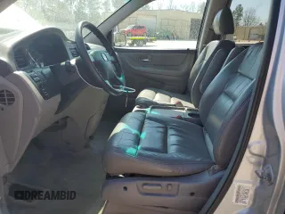 2004 Honda Odyssey EX-L with VIN 5FNRL18974B074613, listed as a Copart auction lot 48924865 with 212,633 mi miles and Salvage Title. Bid and sale history available at DreamBid. Image 7.