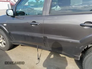 2006 Mazda Tribute LX with VIN 4F2YZ94136KM23037, listed as a IAAI auction lot 42220090 with 144,039 mi miles and . Bid and sale history available at carsss.com. Image 6.