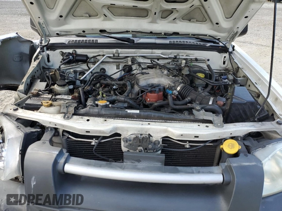 2003 Nissan Frontier XE with VIN 1N6ED29X13C419979, listed as a Copart auction lot 65806585 with 167,535 mi miles and Salvage title. Bid and sale history available at DreamBid. Image 11.