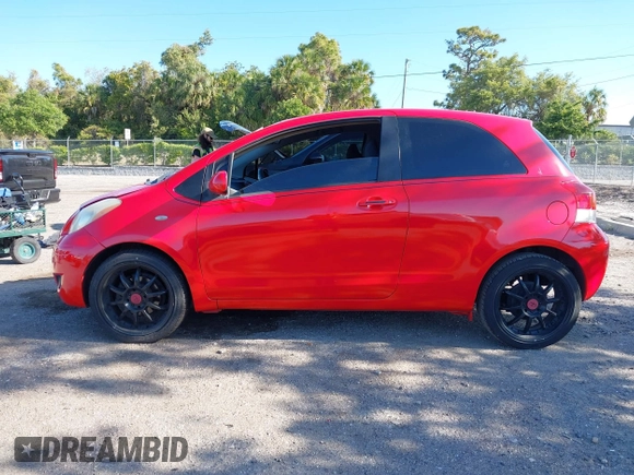2009 Toyota Yaris with VIN JTDJT903695234623, listed as a IAAI auction lot 42027852 with 146,000 mi miles. Bid and sale history available at carsss.com. Image 14.