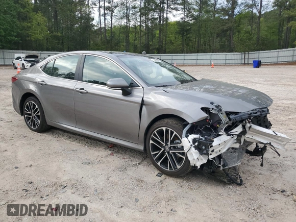 2025 Toyota Camry LE with VIN 4T1DAACKXSU556874, listed as a Copart auction lot 52694525 with 7,076 mi miles and Salvage Title. Bid and sale history available at carsss.com. Image 4.