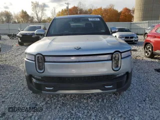 2023 Rivian R1T Adventure with VIN 7FCTGAAA2PN017170, listed as a Copart auction lot 77473014 with 28,821 mi miles and Salvage Title. Bid and sale history available at DreamBid. Image 5.