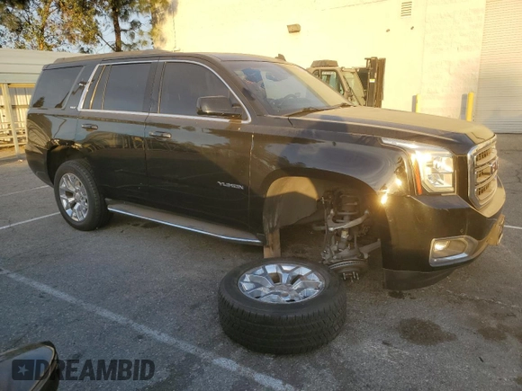 2015 GMC Yukon SLT with VIN 1GKS1BKC9FR144289, listed as a Copart auction lot 42179675 with 122,807 mi miles and Salvage Title. Bid and sale history available at carsss.com. Image 4.