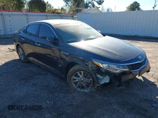 2019 Kia Optima LX with VIN 5XXGT4L3XKG292437, listed as a IAAI auction lot 40682048 with 151,012 mi miles. Bid and sale history available at carsss.com. Image 1.