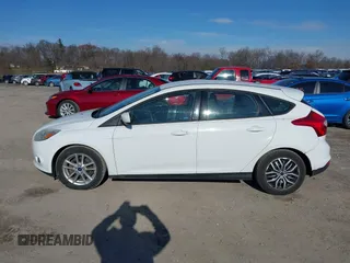 2012 Ford Focus SE z VIN 1FAHP3K29CL265135, wystawiony jako IAAI lot #40989480 z przebiegiem 158 742 mil mil oraz . Historia ofert i sprzedaży dostępna na DreamBid. Obrazek 14.