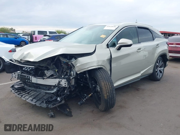 2021 Lexus RX 450h with VIN 2T2HGMDA0MC067228, listed as a IAAI auction lot 41818836 with 28,850 mi miles and . Bid and sale history available at DreamBid. Image 2.