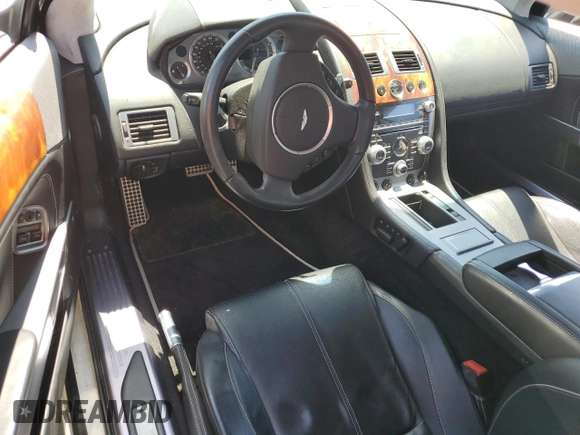 2009 Aston Martin DB9 z VIN SCFAD01E59GA10941, wystawiony jako Copart lot #57220313 z przebiegiem 24 818 mil mil oraz . Historia ofert i sprzedaży dostępna na DreamBid. Obrazek 8.