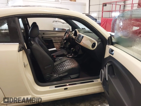 2019 Volkswagen Beetle S with VIN 3VWFD7ATXKM705322, listed as a IAAI auction lot 41409600 with 97,479 mi miles. Bid and sale history available at carsss.com. Image 5.