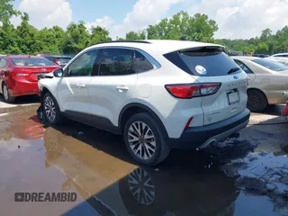 2020 Ford Escape Titanium z VIN 1FMCU9J90LUA39747, wystawiony jako IAAI lot #42369890 z przebiegiem 31 425 mil mil oraz . Historia ofert i sprzedaży dostępna na DreamBid. Obrazek 3.