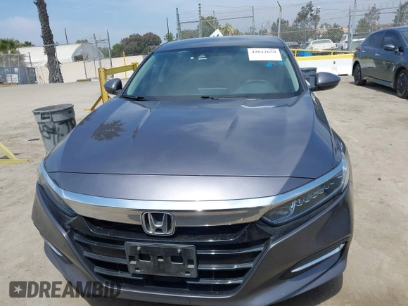 2020 Honda Accord with VIN 1HGCV3F11LA015901, listed as a IAAI auction lot 42022659 with 131,865 mi miles and . Bid and sale history available at DreamBid. Image 12.