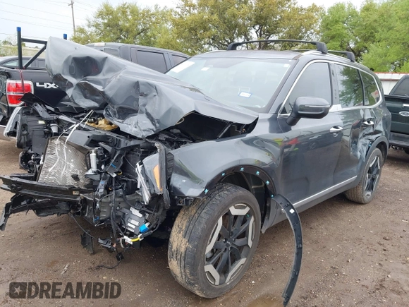 2023 Kia Telluride S with VIN 5XYP6DGC7PG339945, listed as a IAAI auction lot 41903398 with 25,072 mi miles and . Bid and sale history available at DreamBid. Image 2.