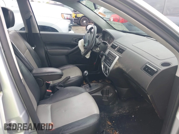 2007 Ford Focus S z VIN 1FAHP34N57W326220, wystawiony jako IAAI lot #42123072 z przebiegiem Nie podano mil oraz . Historia ofert i sprzedaży dostępna na DreamBid. Obrazek 5.