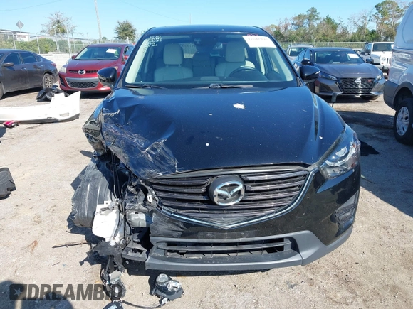 2016 Mazda CX-5 Grand Touring with VIN JM3KE4DY4G0677605, listed as a IAAI auction lot 41642893 with Not Provided miles and . Bid and sale history available at carsss.com. Image 12.