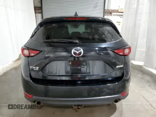 2018 Mazda CX-5 Grand Touring with VIN JM3KFBDM1J0440947, listed as a Copart auction lot 48579825 with 63,164 mi miles and Non Repairable. Bid and sale history available at carsss.com. Image 6.