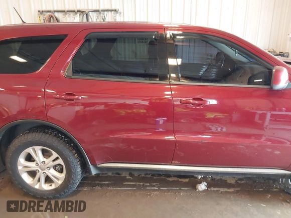 2013 Dodge Durango SXT with VIN 1C4RDJAG4DC527945, listed as a IAAI auction lot 41590545 with 141,074 mi miles and . Bid and sale history available at DreamBid. Image 14.