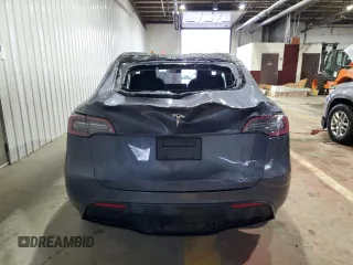 2023 Tesla Model Y Long Range z VIN 7SAYGDEE8PF814874, wystawiony jako Copart lot #56546365 z przebiegiem 20 919 mil mil oraz Szkoda całkowita • Salvage title. Historia ofert i sprzedaży dostępna na DreamBid. Obrazek 6.