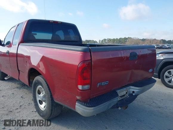2000 Ford F-150 XL with VIN 1FTZX1729YNC32076, listed as a IAAI auction lot 41523364 with 216,726 mi miles. Bid and sale history available at carsss.com. Image 6.