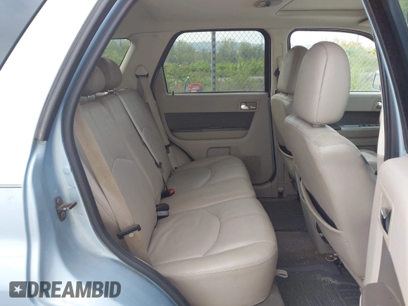 2009 Mercury Mariner Premier z VIN 4M2CU87G69KJ06922, wystawiony jako IAAI lot #42250221 z przebiegiem 145 917 mil mil oraz . Historia ofert i sprzedaży dostępna na DreamBid. Obrazek 8.