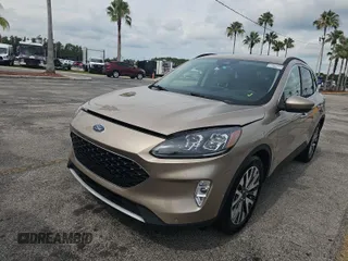 2020 Ford Escape Titanium Hybrid with VIN 1FMCU0DZ8LUC01986, listed as a IAAI auction lot 42681562 with 72,452 mi miles and . Bid and sale history available at DreamBid. Image 1.
