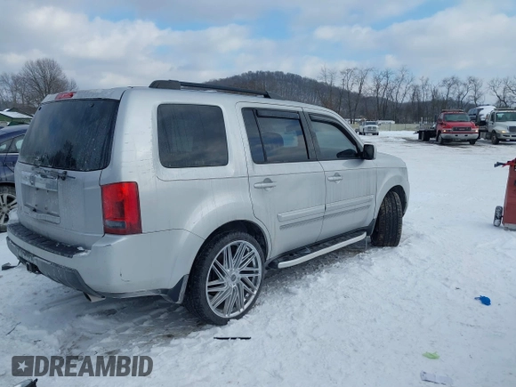 2011 Honda Pilot EX-L with VIN 5FNYF3H6XBB041672, listed as a IAAI auction lot 41337038 with 205,741 mi miles and . Bid and sale history available at DreamBid. Image 4.