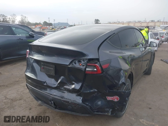 2024 Tesla Model Y with VIN 7SAYGDED8RF116209, listed as a IAAI auction lot 41761804 with 12,048 mi miles and . Bid and sale history available at DreamBid. Image 4.