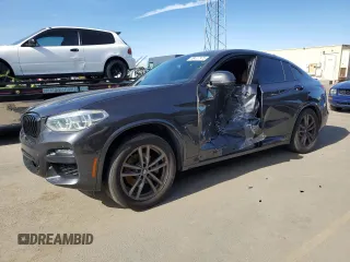 2020 BMW X4 xDrive30i with VIN 5UX2V1C04L9C32419, listed as a Copart auction lot 46427975 with 58,623 mi miles and Salvage Title. Bid and sale history available at carsss.com. Image 1.