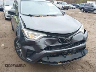 2017 Toyota RAV4 LE with VIN JTMBFREV3HJ704411, listed as a IAAI auction lot 40868831 with 102,729 mi miles. Bid and sale history available at carsss.com. Image 6.