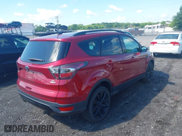 2017 Ford Escape SE z VIN 1FMCU9GD4HUA10240, wystawiony jako IAAI lot #42392522 z przebiegiem 82 325 mil mil oraz . Historia ofert i sprzedaży dostępna na DreamBid. Obrazek 4.