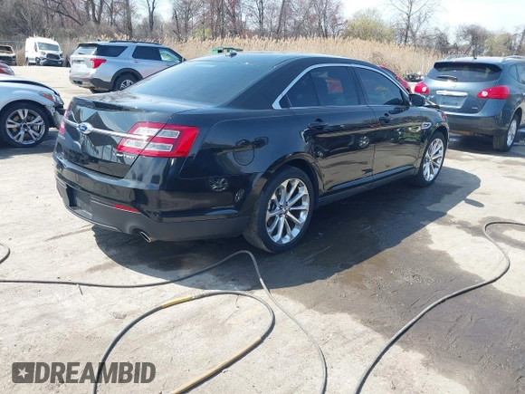 2014 Ford Taurus Limited with VIN 1FAHP2F80EG104984, listed as a IAAI auction lot 41910463 with 174,034 mi miles. Bid and sale history available at carsss.com. Image 4.