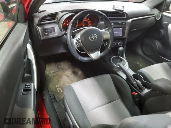 2014 Scion tC z VIN JTKJF5C71E3072025, wystawiony jako Copart lot #51967285 z przebiegiem 187 091 mil mil oraz Szkody całkowita. Historia ofert i sprzedaży dostępna na DreamBid. Obrazek 8.