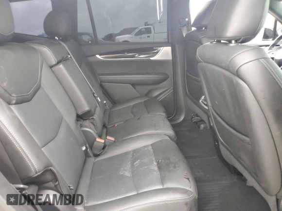 2021 Cadillac XT6 Premium Luxury z VIN 1GYKPCRS1MZ169952, wystawiony jako Copart lot #51908895 z przebiegiem 31 834 mil mil oraz Szkody całkowita. Historia ofert i sprzedaży dostępna na DreamBid. Obrazek 11.
