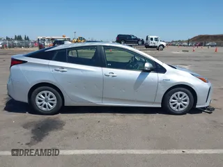 2020 Toyota Prius L Eco with VIN JTDKARFU0L3109212, listed as a IAAI auction lot 42356801 with 81,478 mi miles and . Bid and sale history available at DreamBid. Image 13.