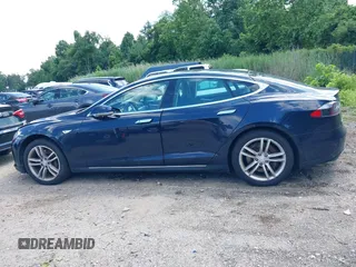 2013 Tesla Model S with VIN 5YJSA1CN0DFP21851, listed as a IAAI auction lot 42557791 with 106,328 mi miles and . Bid and sale history available at DreamBid. Image 15.