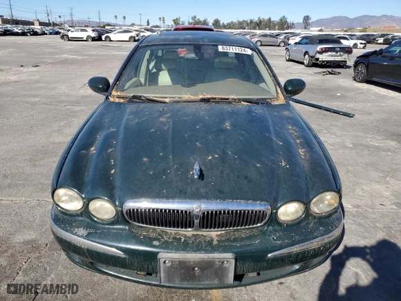 2002 Jaguar X-Type with VIN SAJEA51C12WC33477, listed as a Copart auction lot 83711124 with 165,637 mi miles and Salvage Title. Bid and sale history available at carsss.com. Image 5.