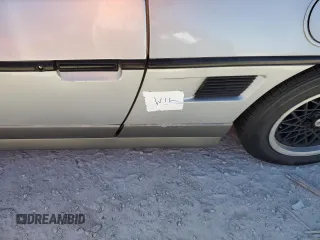 1986 Pontiac Fiero z VIN 1G2PG9799GP261135, wystawiony jako Copart lot #77305934 z przebiegiem 53 837 mil mil oraz Szkody całkowita. Historia ofert i sprzedaży dostępna na DreamBid. Obrazek 12.