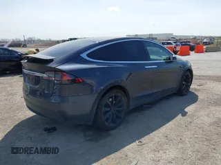2017 Tesla Model X 90D with VIN 5YJXCBE22HF079194, listed as a IAAI auction lot 41895591 with 102,437 mi miles and . Bid and sale history available at DreamBid. Image 4.