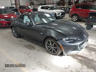 2021 Mazda MX-5 Miata Grand Touring with VIN JM1NDAM73M0451484, listed as a IAAI auction lot 41485044 with 11,328 mi miles and . Bid and sale history available at DreamBid. Image 1.