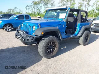 2015 Jeep Wrangler Sport z VIN 1C4AJWAG8FL550859, wystawiony jako IAAI lot #42154946 z przebiegiem 143 658 mil mil oraz . Historia ofert i sprzedaży dostępna na DreamBid. Obrazek 2.