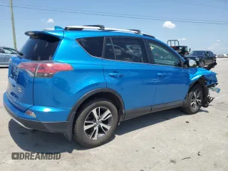 2016 Toyota RAV4 XLE with VIN JTMRFREV2GJ058808, listed as a Copart auction lot 61449135 with 73,985 mi miles and Salvage title. Bid and sale history available at DreamBid. Image 3.