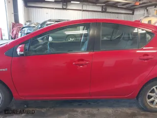 2015 Toyota Prius c One with VIN JTDKDTB3XF1108456, listed as a IAAI auction lot 41743379 with 132,265 mi miles. Bid and sale history available at carsss.com. Image 14.