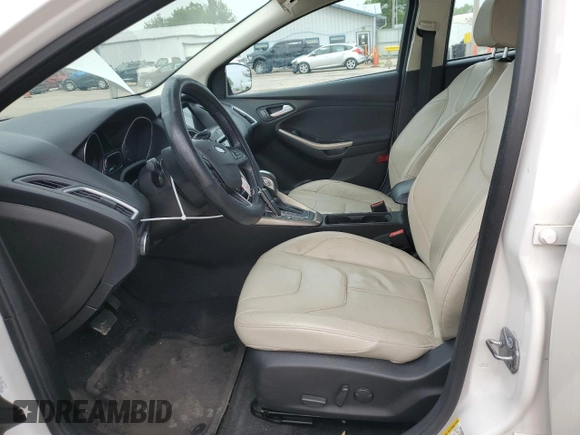 2016 Ford Focus Titanium z VIN 1FADP3N23GL345904, wystawiony jako Copart lot #60139525 z przebiegiem 97 572 mil mil oraz Szkoda całkowita • Salvage title. Historia ofert i sprzedaży dostępna na DreamBid. Obrazek 7.