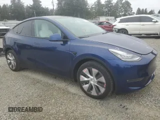 2022 Tesla Model Y Long Range z VIN 7SAYGDEE6NF429651, wystawiony jako Copart lot #57172355 z przebiegiem 19 499 mil mil oraz Szkoda całkowita • Salvage title. Historia ofert i sprzedaży dostępna na DreamBid. Obrazek 4.